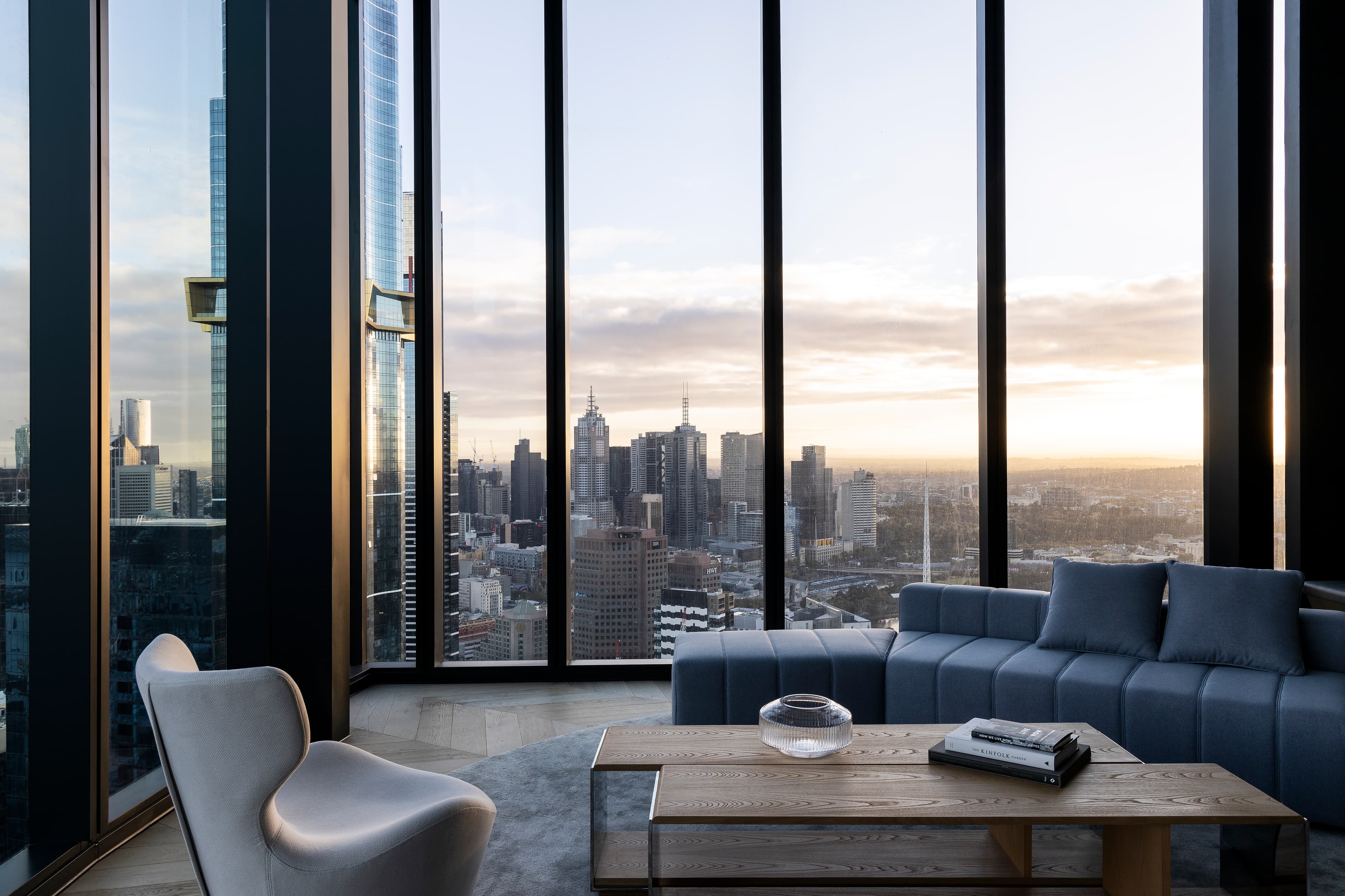 MSQ1 living room with Melbourne skyline at sunset